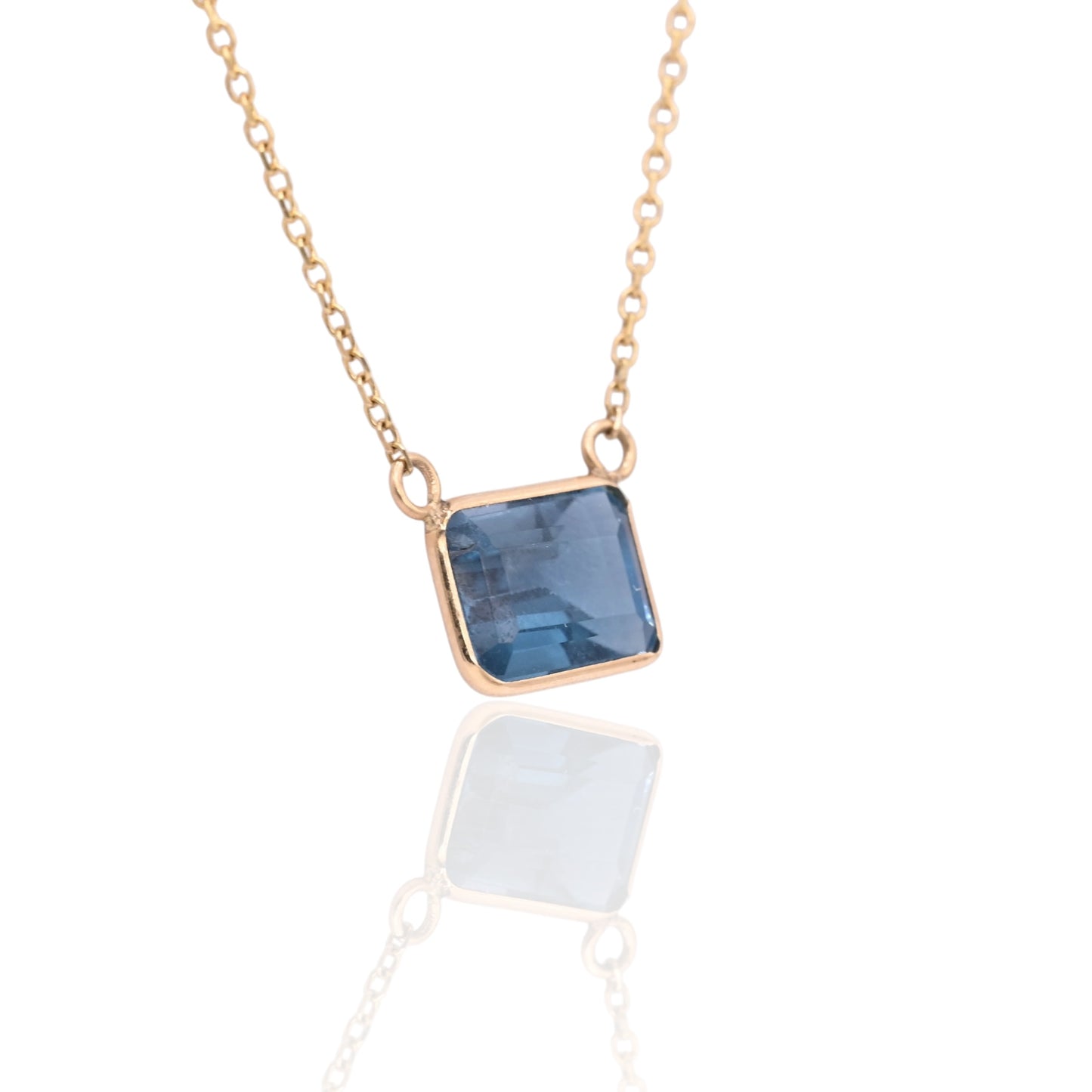 East to West Bezel Blue Topaz Necklace 14K Yellow Gold Adjustable Diamond Cut Chain 16.25in, 17.25in, and 18.25in 1.30cttw