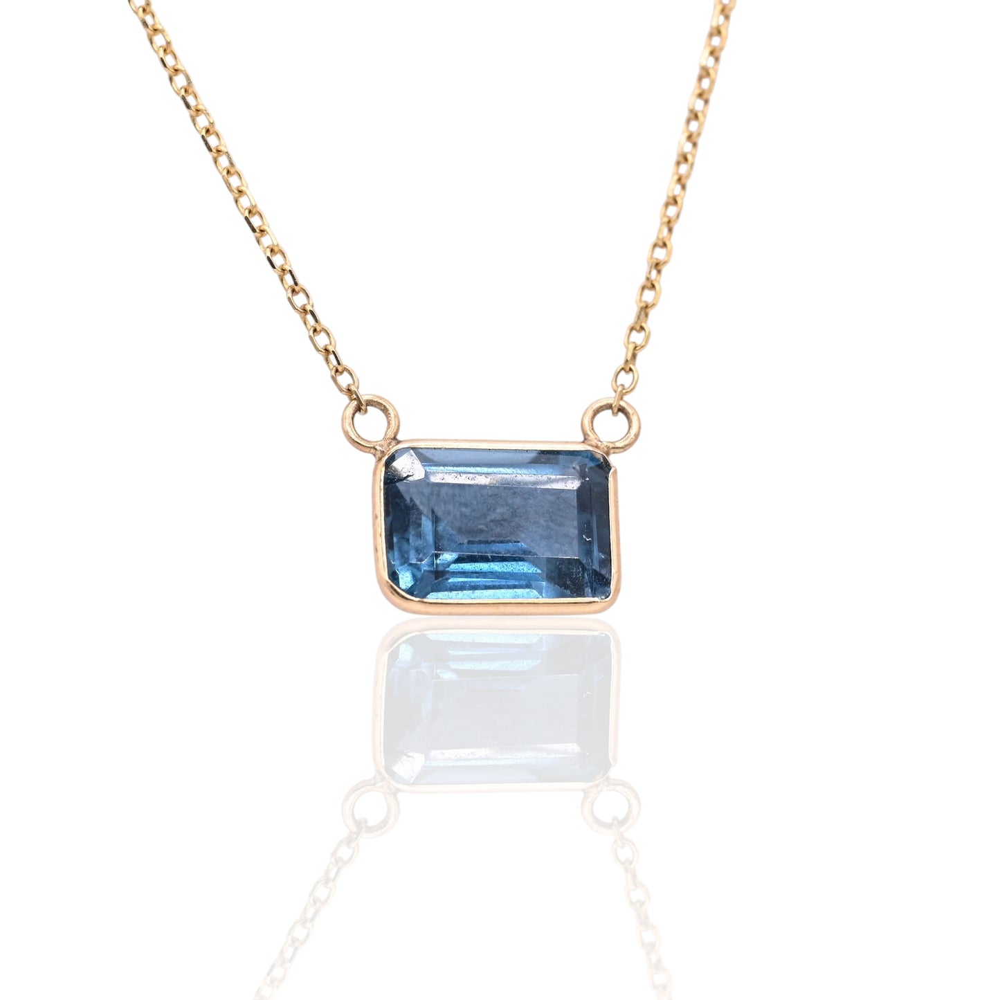 East to West Bezel Blue Topaz Necklace 14K Yellow Gold Adjustable Diamond Cut Chain 16.25in, 17.25in, and 18.25in 1.30cttw